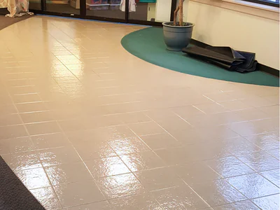 Linoleum floor coating before and after showing dramatic improvement